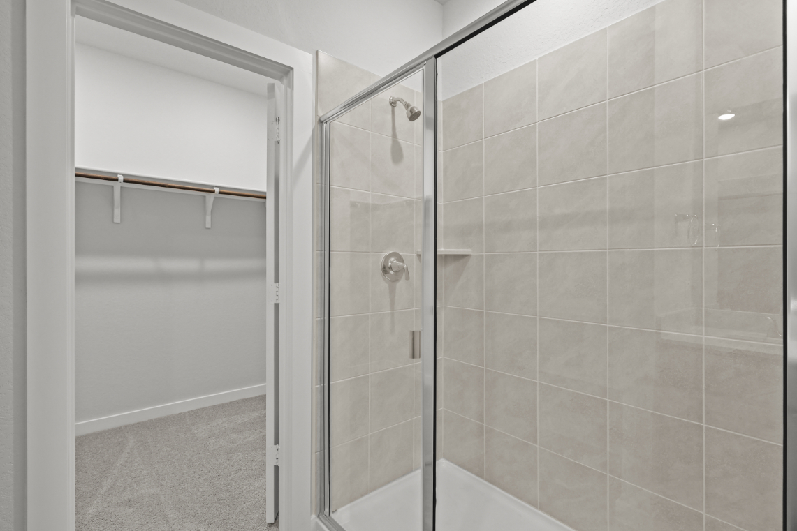 A shower with a glass door.