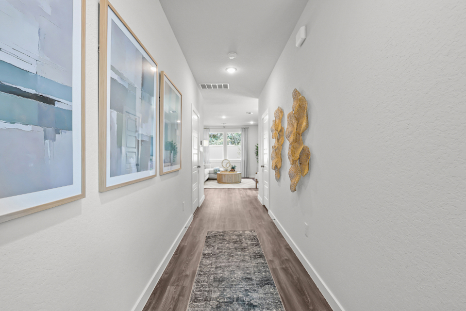 A hallway with white walls.