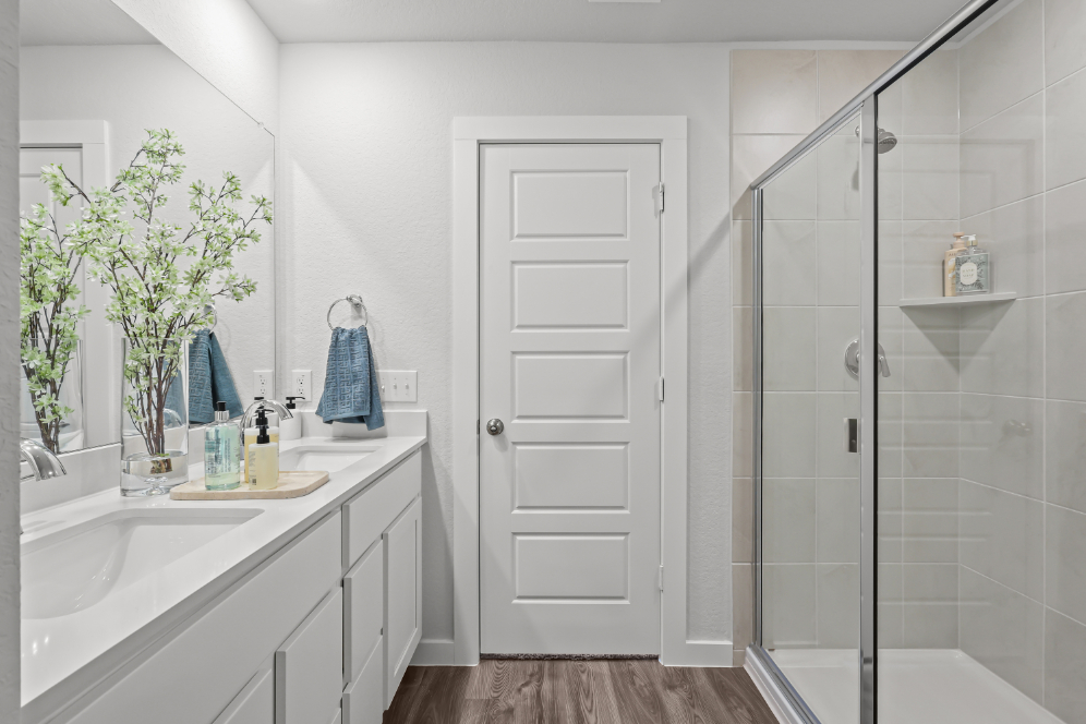 A bathroom with a glass shower.