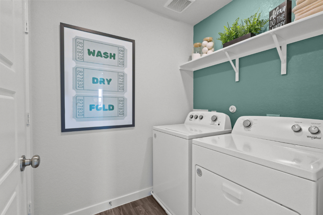 A white wall with a sign on it.