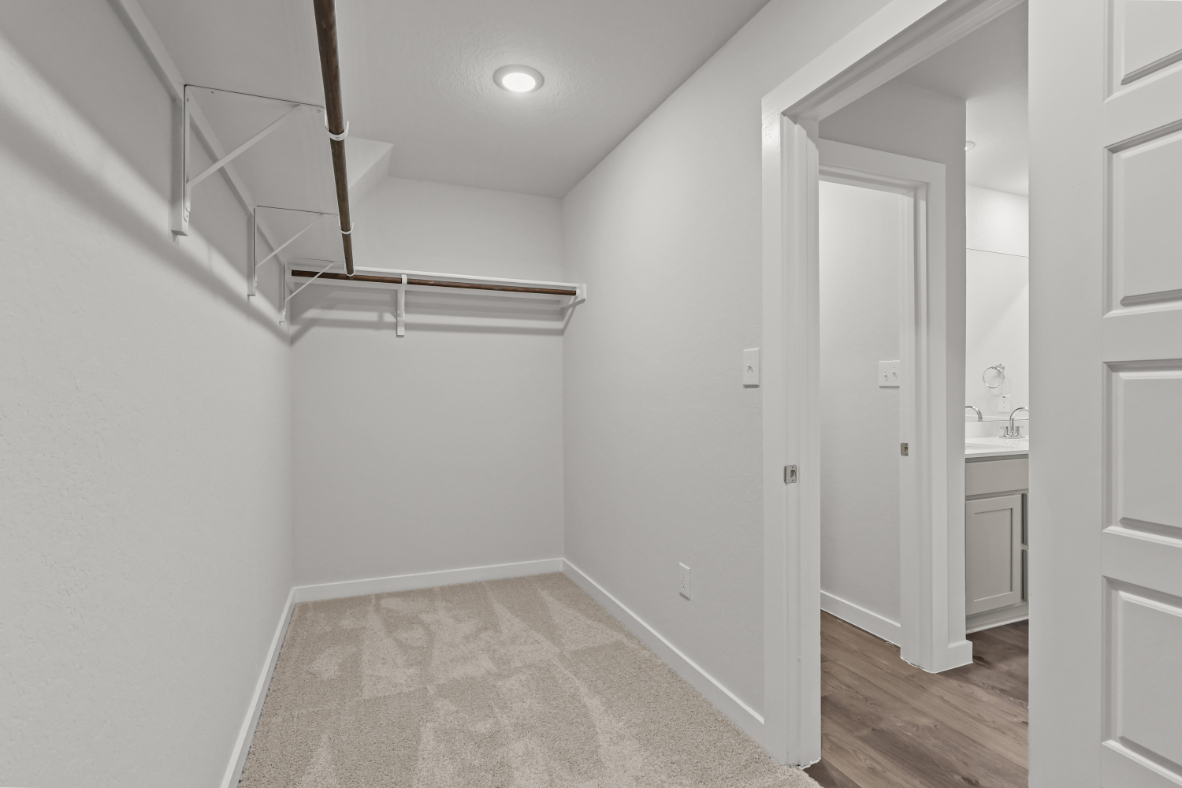 A hallway with white walls.