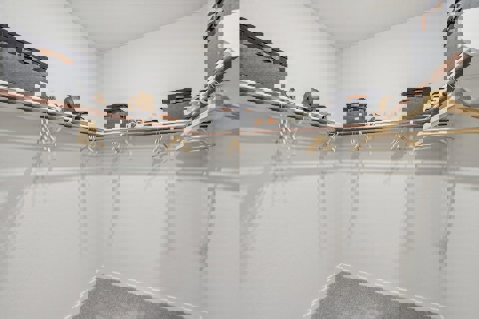 A room with a few objects on the wall.