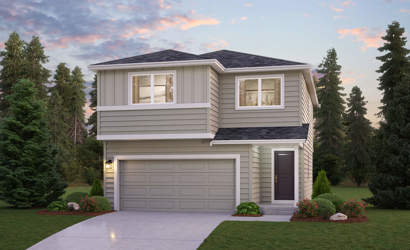 A house with a garage and trees around it.