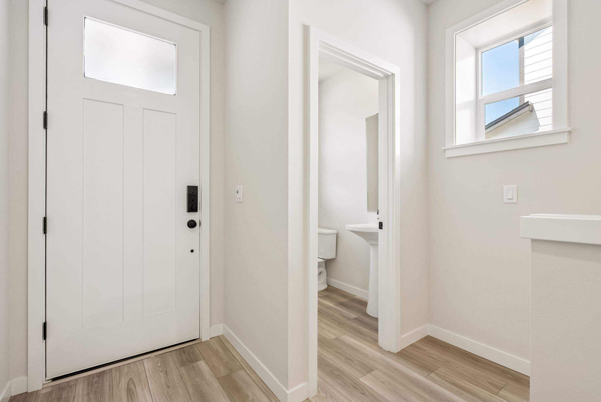 A bathroom with a sink and a toilet.
