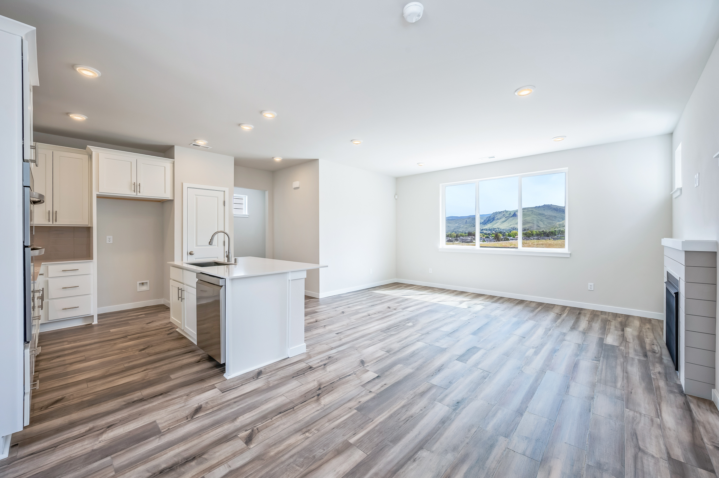 A large kitchen with white cabinets.