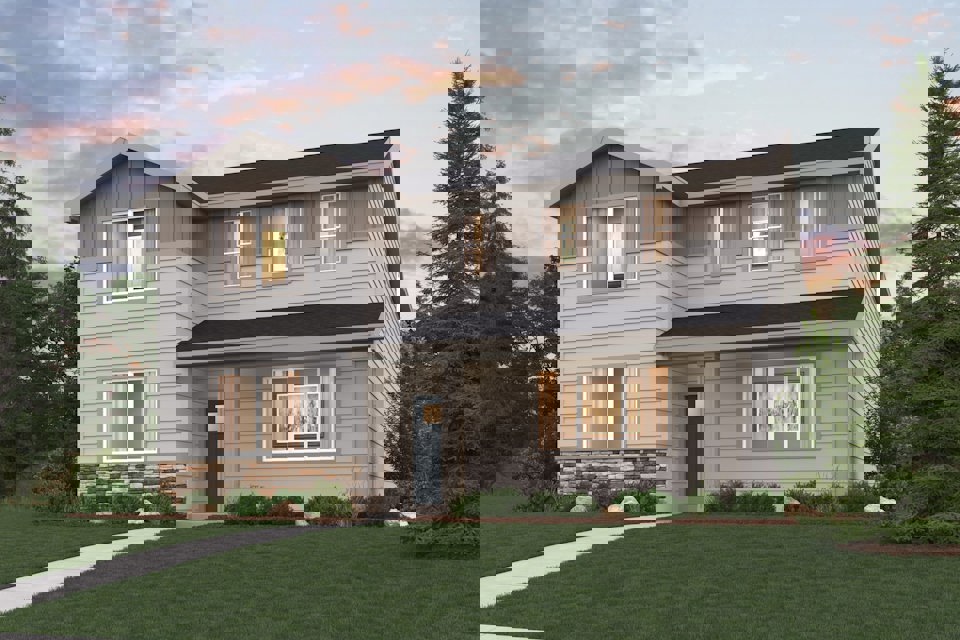 A house with a lawn in front of it.