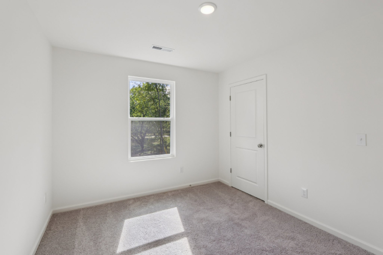 A room with a door and a window.