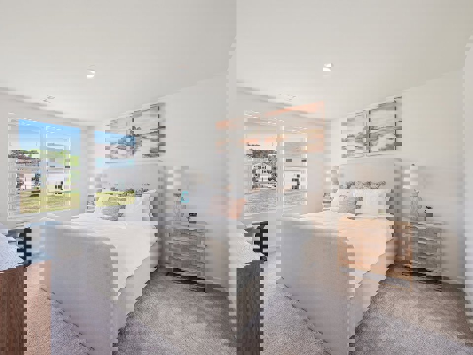 A bedroom with a large bed.