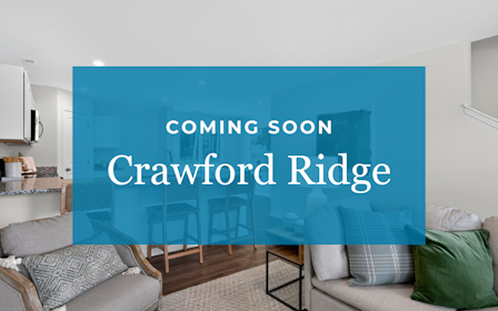 A room with a couch and a table.