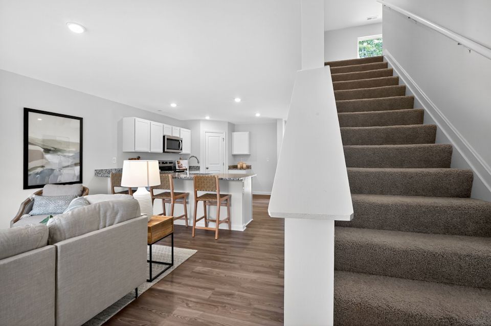 A staircase leading to a living room.