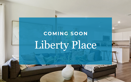 A room with a couch and a table.