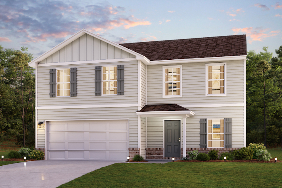 A white house with a garage.
