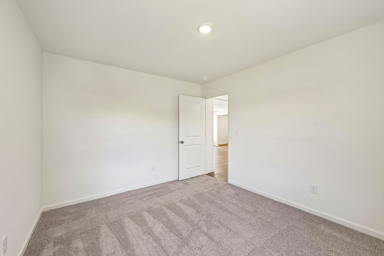 A hallway with white doors.