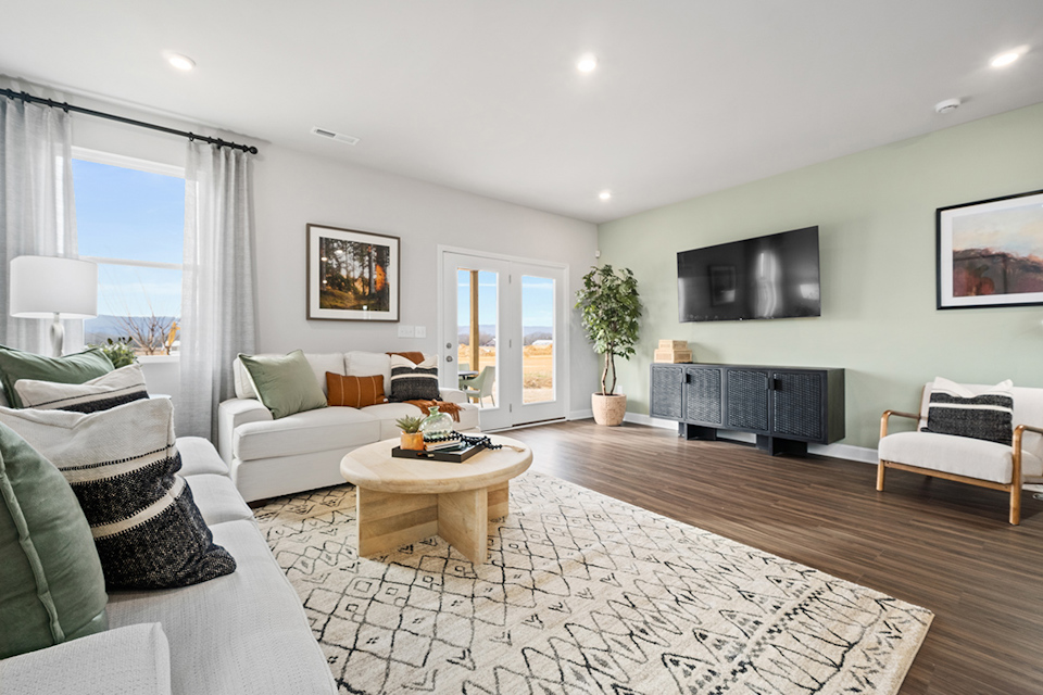 A living room with a wood floor.