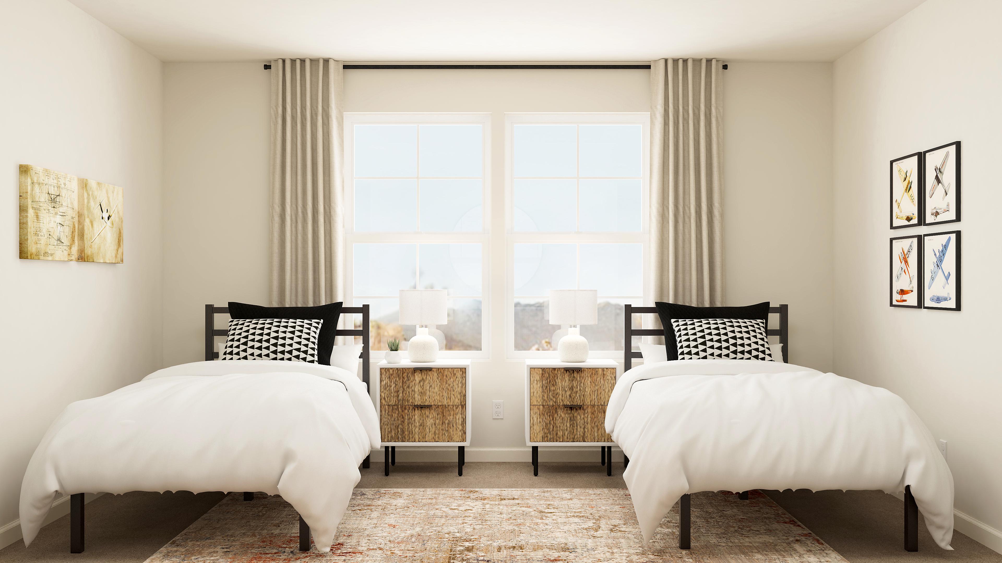 A bedroom with two beds.