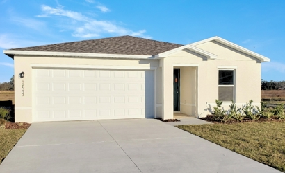 A white garage with a driveway.