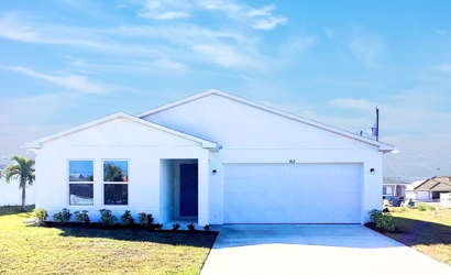 A white building with a blue sky.