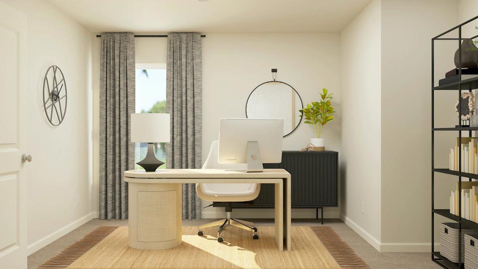 A room with a desk and a computer.