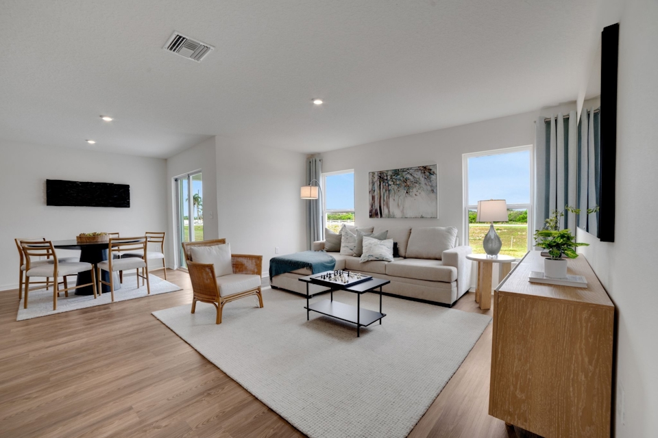 A living room with a wood floor.