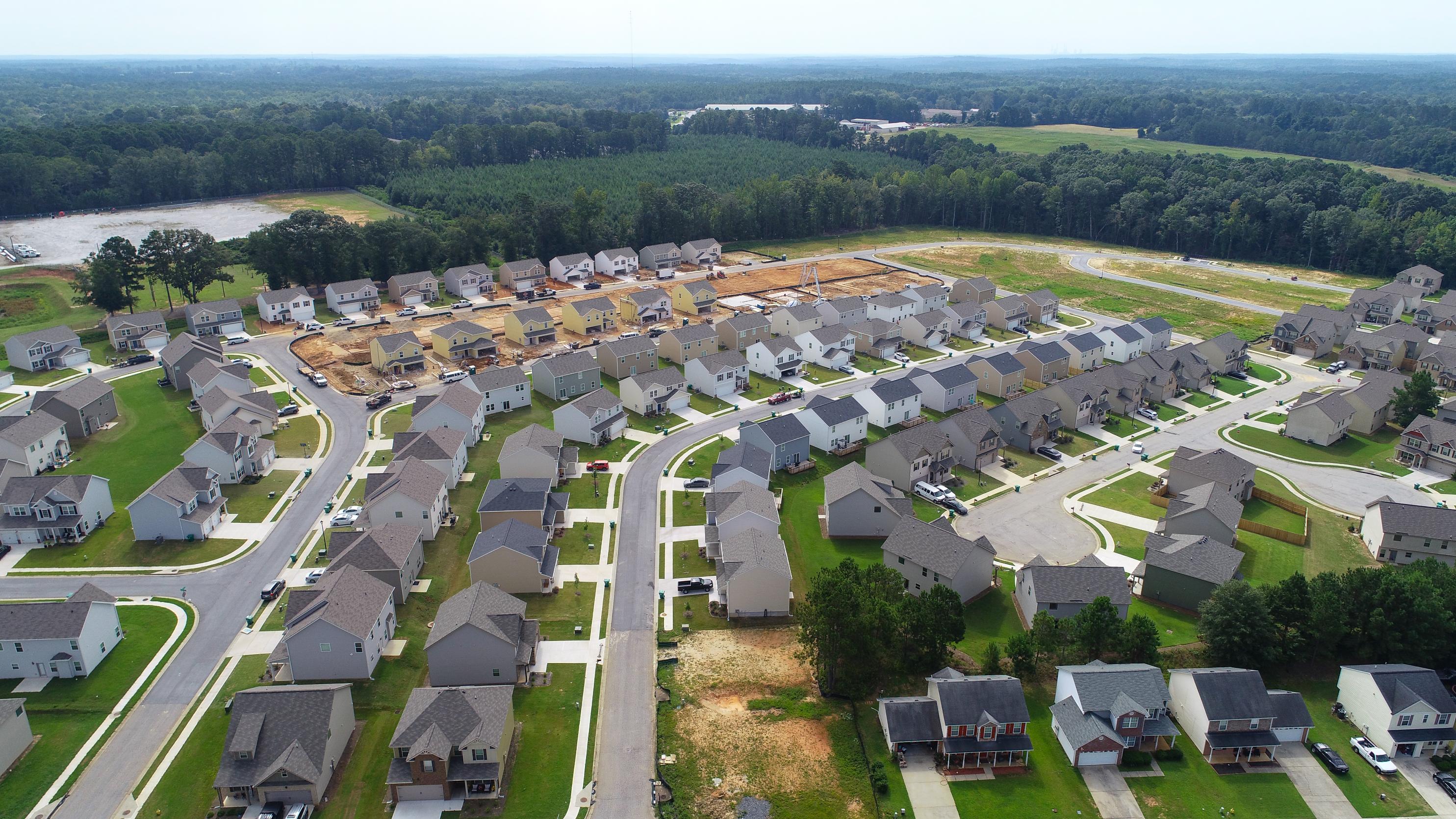 A large area with many buildings and trees around it.