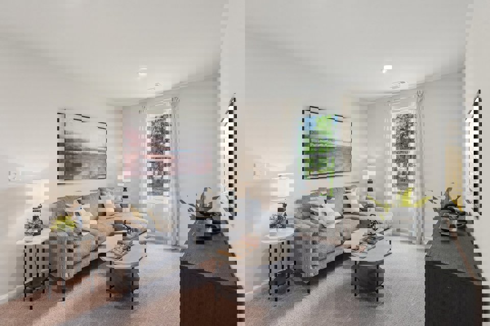 A living room with a couch and a coffee table.