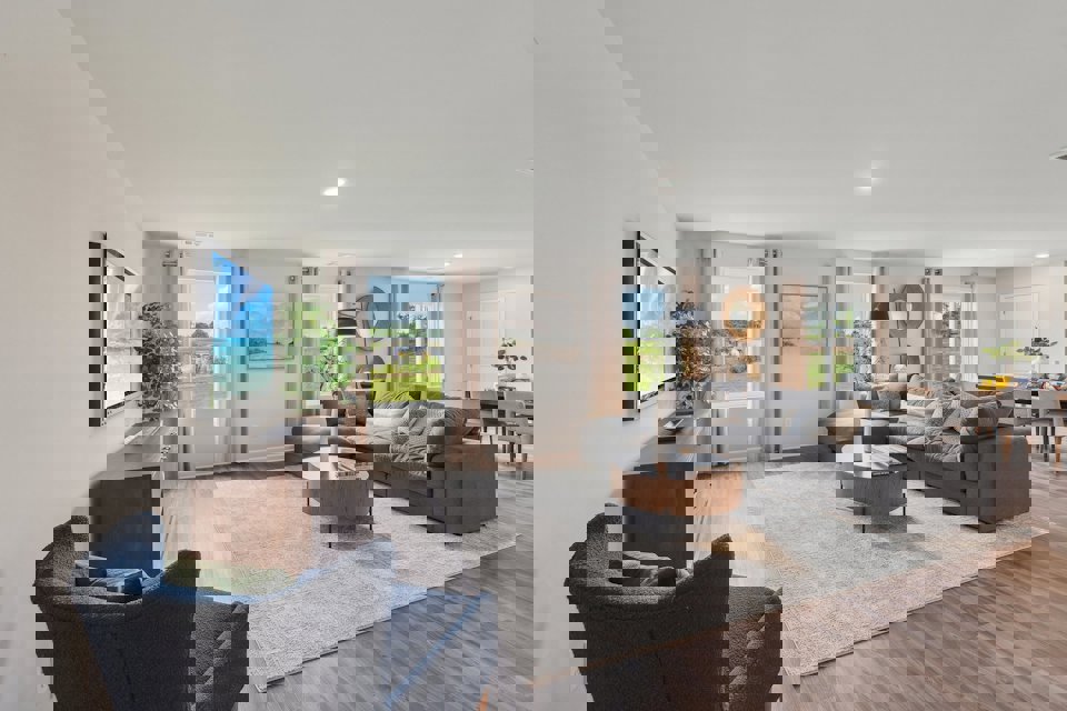 A living room with a large tv.