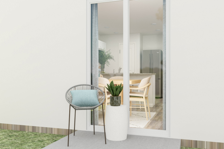 A room with a table chairs and a planter.