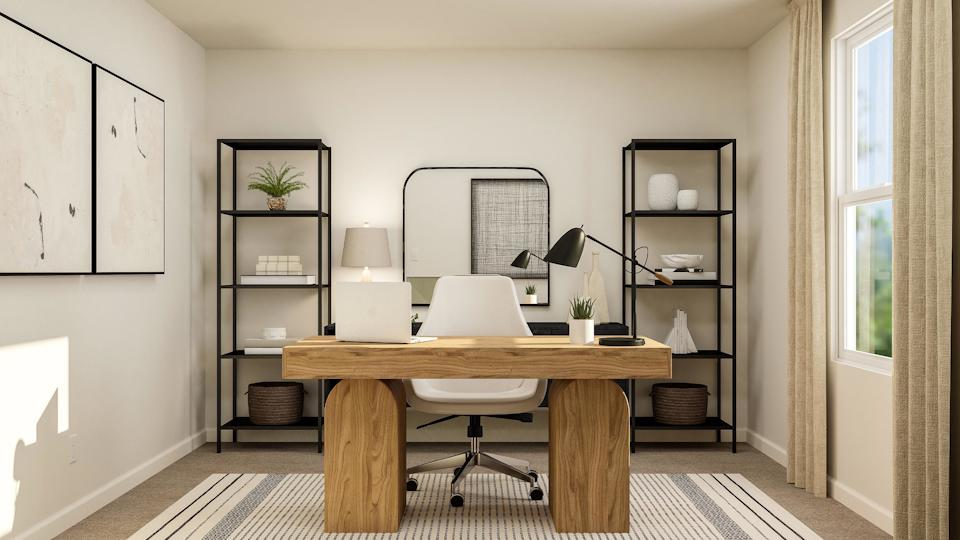 A room with a desk and shelves.