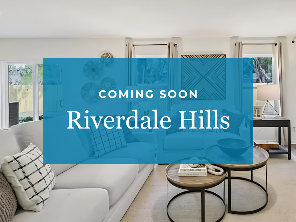 A room with a couch and a table.