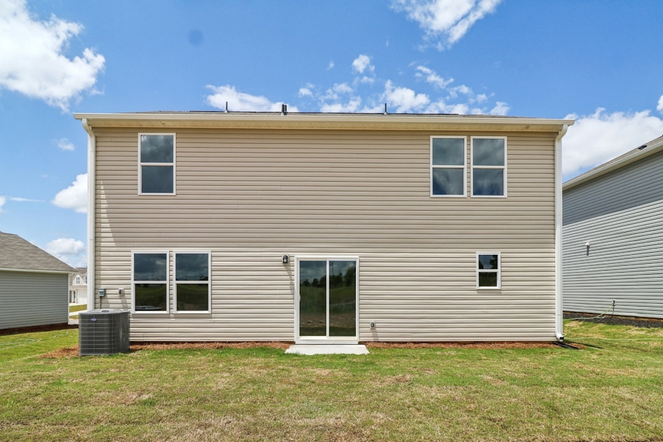 A house with a grass yard.