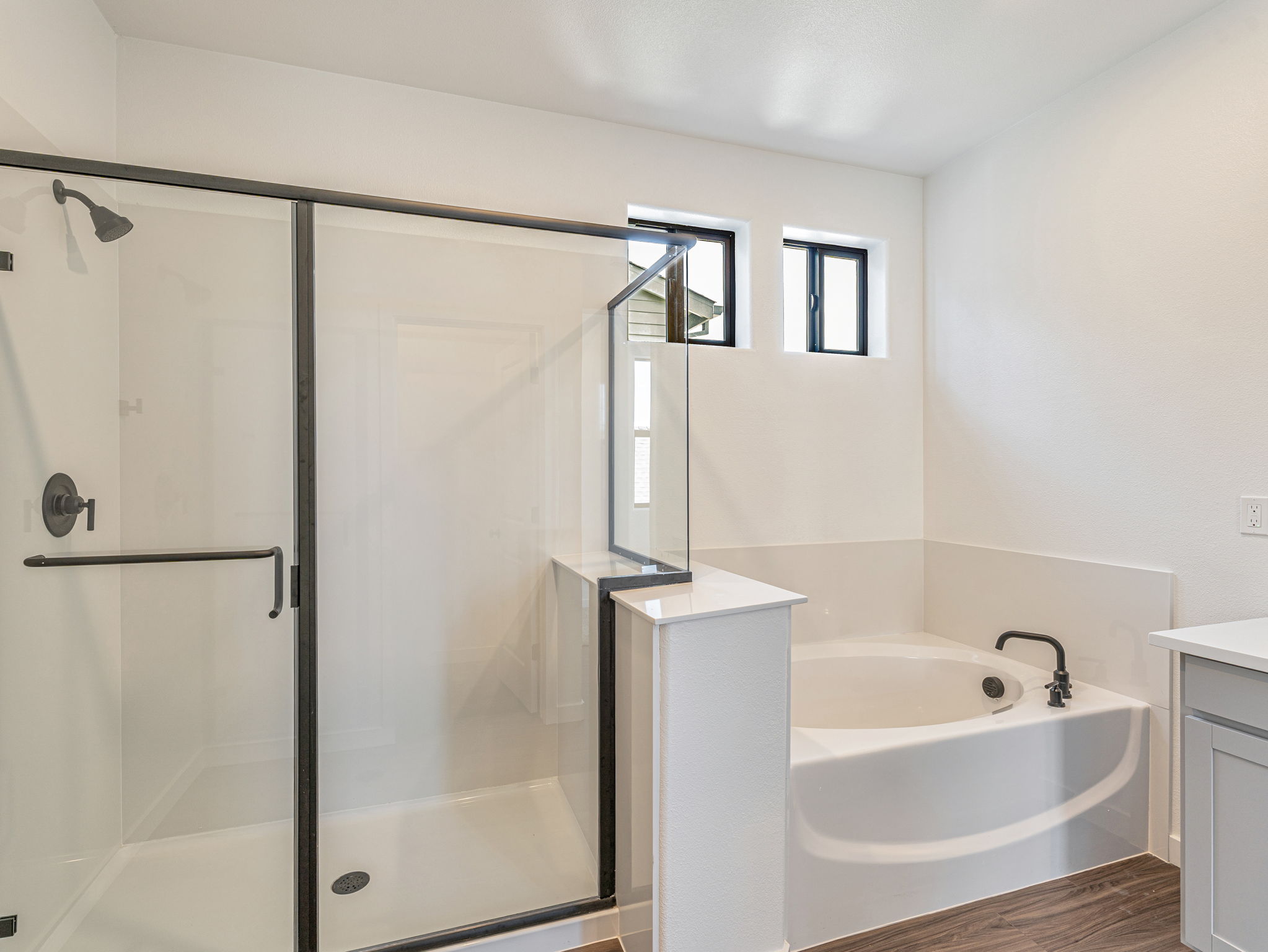 A bathroom with a glass shower.